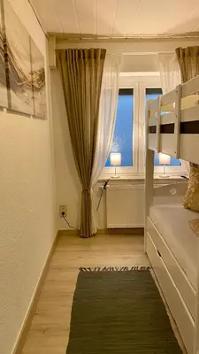 Ein Bett oder Betten in einem Zimmer der Unterkunft Ferienwohnung Elbstübchen