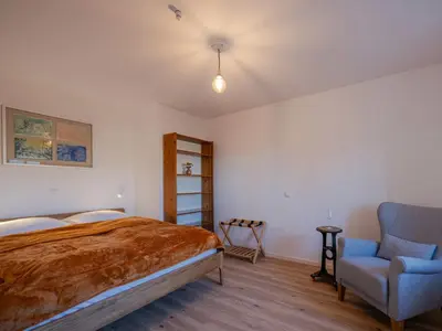 Ein Bett oder Betten in einem Zimmer der Unterkunft Lindenhof Michaelis - Urlaub auf dem historischen Gutshof