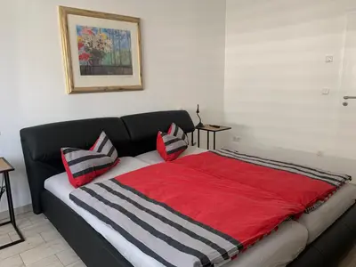 Ein Bett oder Betten in einem Zimmer der Unterkunft Ferienhaus SeenSuchtLausitz