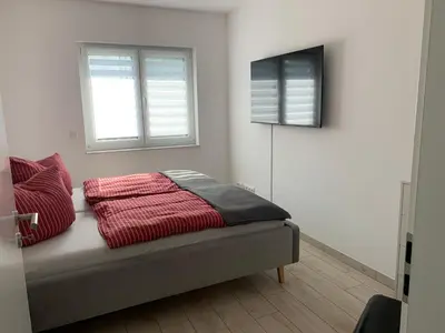 Ein Bett oder Betten in einem Zimmer der Unterkunft Ferienhaus SeenSuchtLausitz