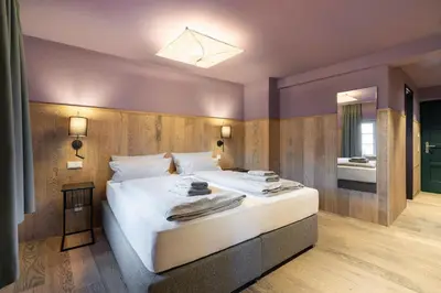 Ein Bett oder Betten in einem Zimmer der Unterkunft Ranunkelhof