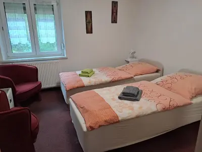 Ein Bett oder Betten in einem Zimmer der Unterkunft Ferienwohnung Hänsch