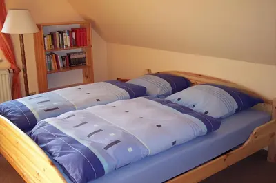 Ein Bett oder Betten in einem Zimmer der Unterkunft Gästezimmer Charlotte