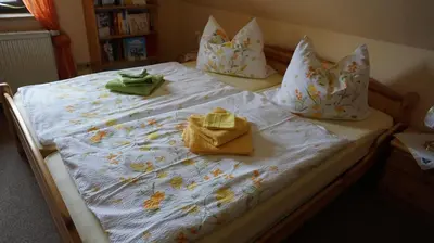 Ein Bett oder Betten in einem Zimmer der Unterkunft Gästezimmer Charlotte