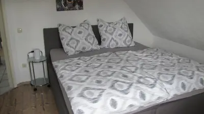 Ein Bett oder Betten in einem Zimmer der Unterkunft Ferienwohnung im Grünen von Dresden