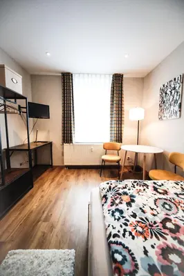 Ein Bett oder Betten in einem Zimmer der Unterkunft Ferienwohnung in Lengefeld