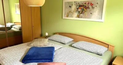 Ein Bett oder Betten in einem Zimmer der Unterkunft Rosengarten Gerlinde