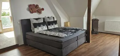 Ein Bett oder Betten in einem Zimmer der Unterkunft SeenSucht & Urlaubsträume, Ferienwohnung 