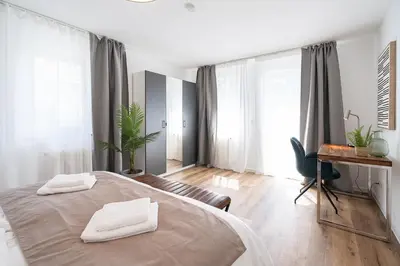 Ein Bett oder Betten in einem Zimmer der Unterkunft Neues 2 Schlafzimmer Apartment mit RooftopTerrace