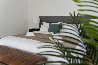 Ein Bett oder Betten in einem Zimmer der Unterkunft Neues 2 Schlafzimmer Apartment mit RooftopTerrace