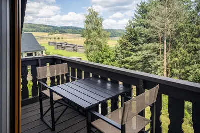 Ein Balkon oder eine Terrasse in der Unterkunft B8 Urlaubsmagie Bergsteigerwohnung mit Balkon mit Aussicht aufs Elbsandsteingebirge