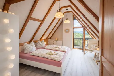 Ein Bett oder Betten in einem Zimmer der Unterkunft B8 Urlaubsmagie Bergsteigerwohnung mit Balkon mit Aussicht aufs Elbsandsteingebirge
