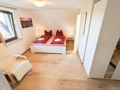 Ein Bett oder Betten in einem Zimmer der Unterkunft B5 Urlaubsmagie Gemütliche Wohnung inmitten der Sächsischen Schweiz
