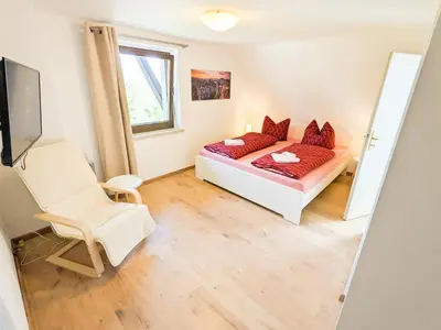 Ein Bett oder Betten in einem Zimmer der Unterkunft B5 Urlaubsmagie Gemütliche Wohnung inmitten der Sächsischen Schweiz