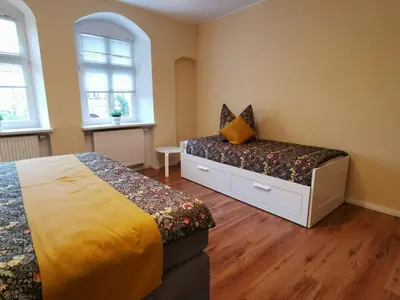 Ein Bett oder Betten in einem Zimmer der Unterkunft Ferienwohnung Schloßblick mit Parkplatz