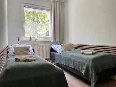 Ein Bett oder Betten in einem Zimmer der Unterkunft Ferienwohnung Leubnitz