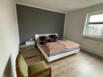 Ein Bett oder Betten in einem Zimmer der Unterkunft Ferienwohnung Heike