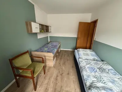 Ein Bett oder Betten in einem Zimmer der Unterkunft Ferienwohnung Heike