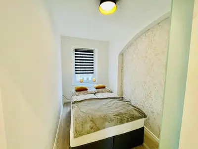 Ein Bett oder Betten in einem Zimmer der Unterkunft Zentrale moderne Unterkunft mitten in Meissen No 2