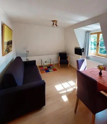 Ein Sitzbereich in der Unterkunft Lotterhof Ferienhaus Gartenhaus
