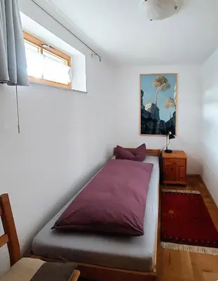 Ein Bett oder Betten in einem Zimmer der Unterkunft Lotterhof Ferienhaus Gartenhaus