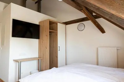Ein Bett oder Betten in einem Zimmer der Unterkunft Zimmer An der Wasserburg
