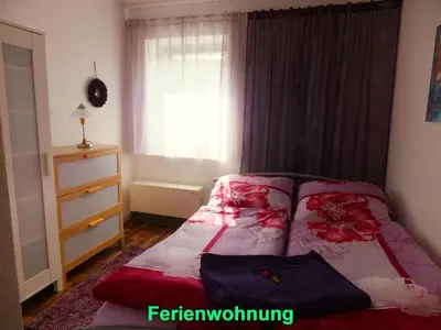 Ein Bett oder Betten in einem Zimmer der Unterkunft Ferienwohnung Sobrigau
