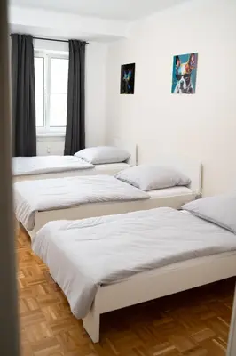 Ein Bett oder Betten in einem Zimmer der Unterkunft Design FerienOase mit Einzelbetten - 2 Schlafzimmer - Waschmaschine - Parkplatz
