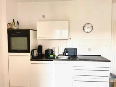 Küche/Küchenzeile in der Unterkunft Design FerienOase mit Einzelbetten - 2 Schlafzimmer - Waschmaschine - Parkplatz