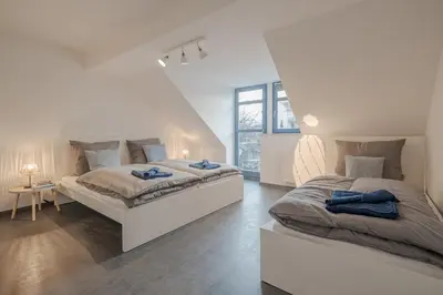 Ein Bett oder Betten in einem Zimmer der Unterkunft Apartmenthaus Meißen