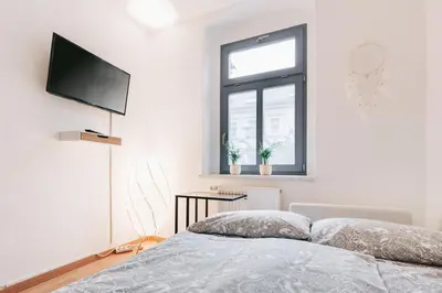 Ein Bett oder Betten in einem Zimmer der Unterkunft Apartmenthaus Meißen