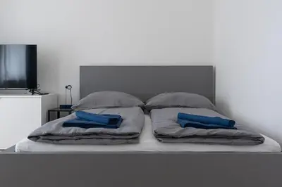 Ein Bett oder Betten in einem Zimmer der Unterkunft Apartmenthaus Meißen