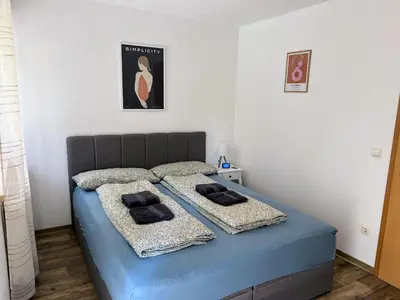Ein Bett oder Betten in einem Zimmer der Unterkunft Famielienapartment An der Forellenschänke