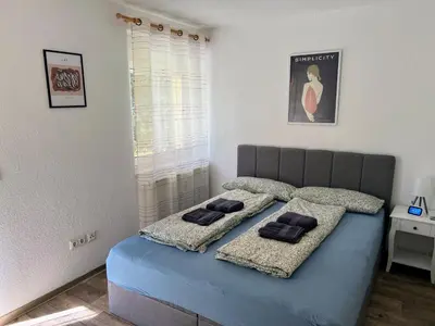 Ein Bett oder Betten in einem Zimmer der Unterkunft Famielienapartment An der Forellenschänke