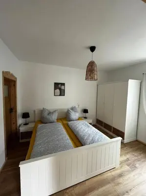 Ein Bett oder Betten in einem Zimmer der Unterkunft Ferienwohnung zur Parthe