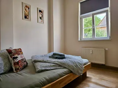 Ein Bett oder Betten in einem Zimmer der Unterkunft African Style in Kleinwelka