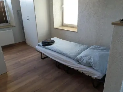 Ein Bett oder Betten in einem Zimmer der Unterkunft FeWo Am Marktplatz