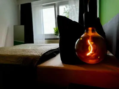 Ein Bett oder Betten in einem Zimmer der Unterkunft KMHosting Zentrum Luxe Apartment Balkon