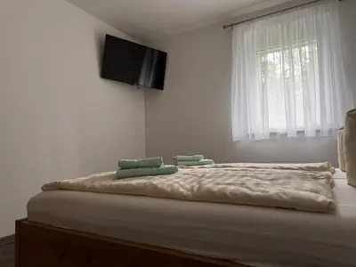 Ein Bett oder Betten in einem Zimmer der Unterkunft Ferienhaus Barbarine