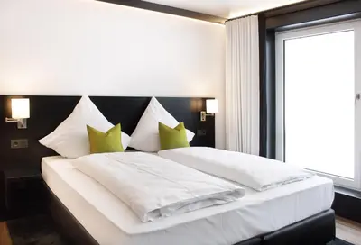 Ein Bett oder Betten in einem Zimmer der Unterkunft FG Hotel by WMM Hotels