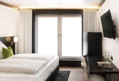 Ein Bett oder Betten in einem Zimmer der Unterkunft FG Hotel by WMM Hotels