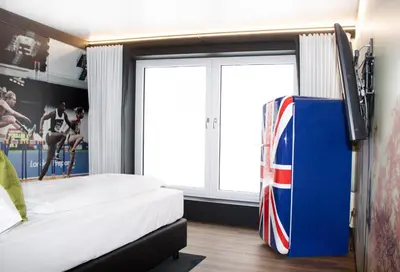 Ein Bett oder Betten in einem Zimmer der Unterkunft FG Hotel by WMM Hotels