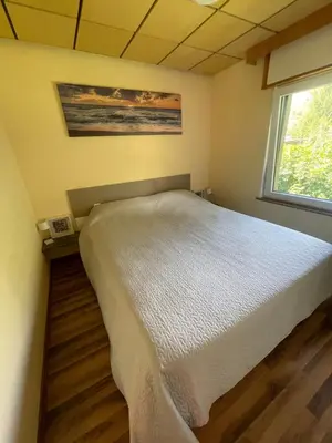 Ein Bett oder Betten in einem Zimmer der Unterkunft Grüner Bungalow am Kiebitzsee