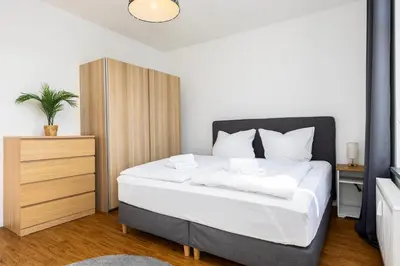 Ein Bett oder Betten in einem Zimmer der Unterkunft 70 qm Wohlfühlperle - ruhig und trotzdem schnell im Zentrum - großer Balkon