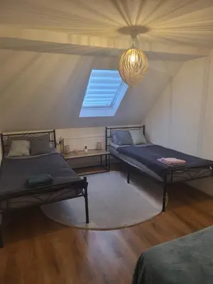 Ein Bett oder Betten in einem Zimmer der Unterkunft Haus Svetlana Zweizimmer Ferienwohnung