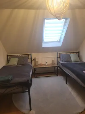 Ein Bett oder Betten in einem Zimmer der Unterkunft Haus Svetlana Zweizimmer Ferienwohnung