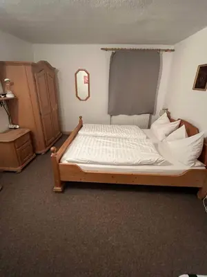 Ein Bett oder Betten in einem Zimmer der Unterkunft Ferienwohnung Zschopautal