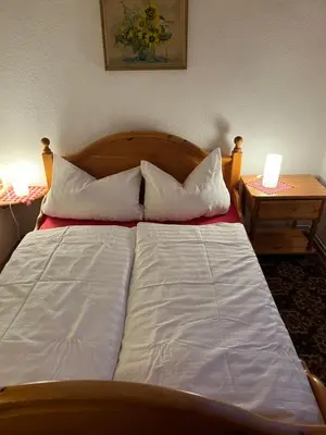 Ein Bett oder Betten in einem Zimmer der Unterkunft Ferienwohnung Zschopautal