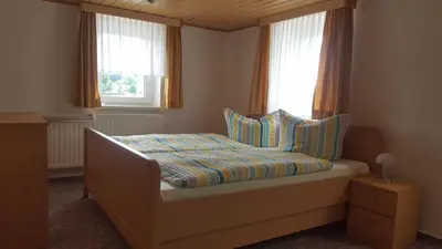 Ein Bett oder Betten in einem Zimmer der Unterkunft Haus Elbtalblick