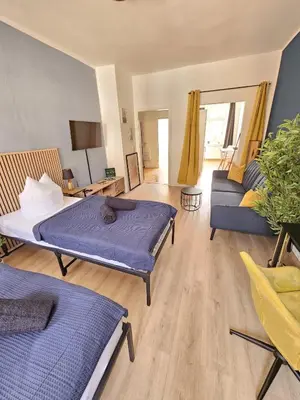 Ein Bett oder Betten in einem Zimmer der Unterkunft Moderne Ferienwohnung in unmittelbarer Nähe zum Schloss